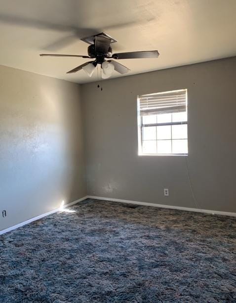 carpeted empty room with ceiling fan