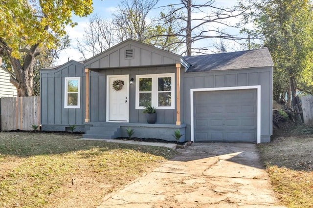 ranch-style home with a front lawn and a garage