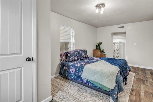 bedroom featuring wood-type flooring