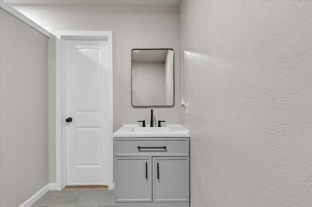 bathroom featuring tile patterned flooring and vanity