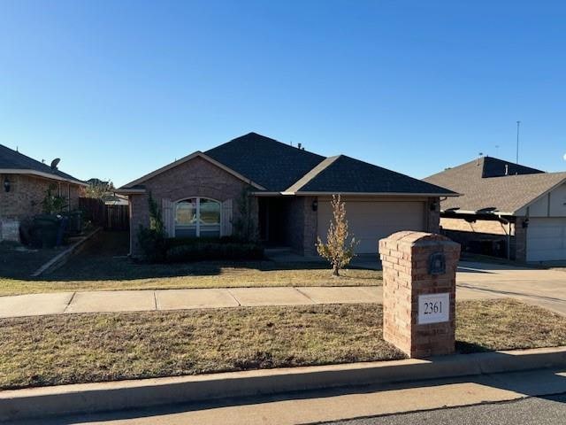 ranch-style house featuring a garage