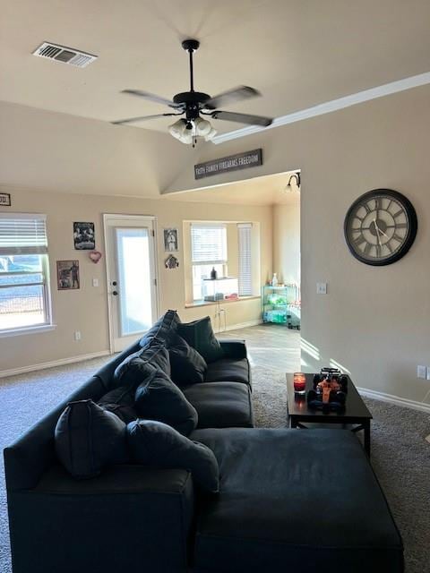 living room with ceiling fan, light colored carpet, and vaulted ceiling