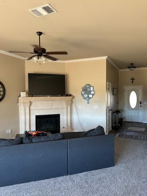 unfurnished living room with carpet flooring, ceiling fan, and crown molding