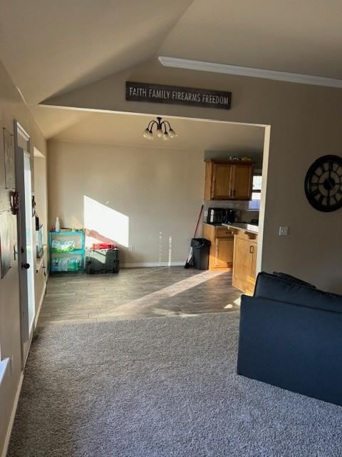 unfurnished living room featuring lofted ceiling, crown molding, and light carpet