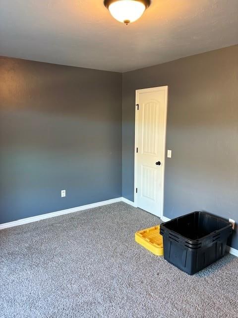 empty room featuring carpet flooring