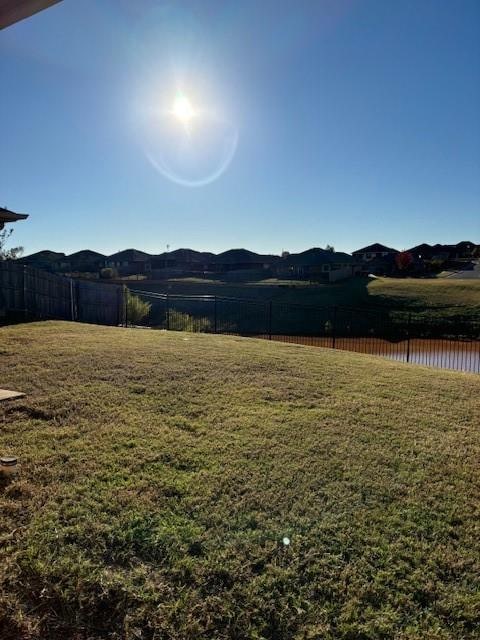 view of yard featuring a water and mountain view