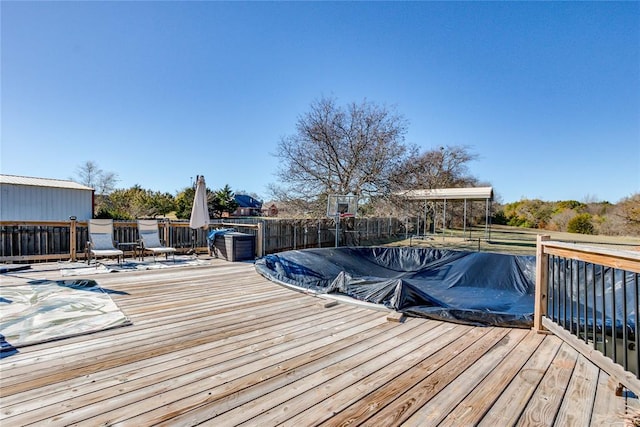 deck with a covered pool