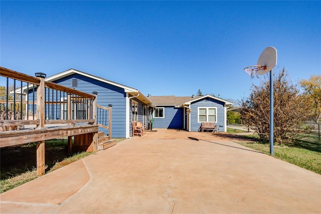 rear view of property with a wooden deck