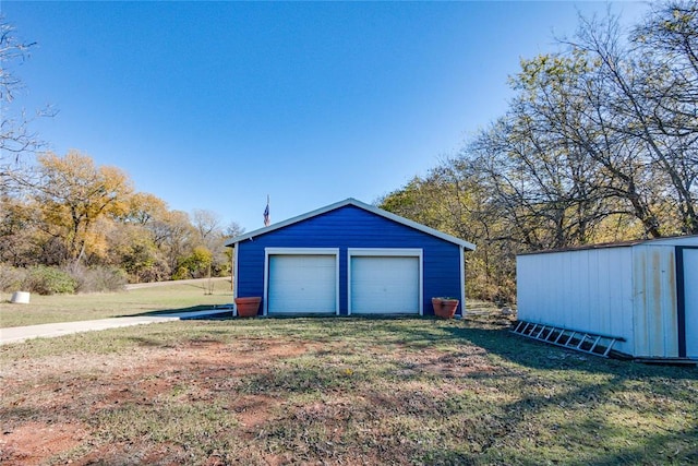 garage with a lawn