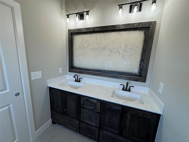 bathroom featuring tile patterned flooring and vanity