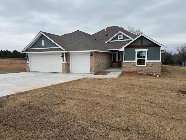 craftsman-style house with a front lawn and a garage