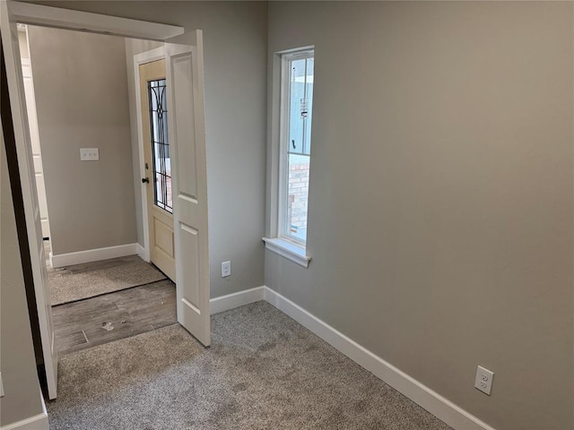 view of carpeted entrance foyer