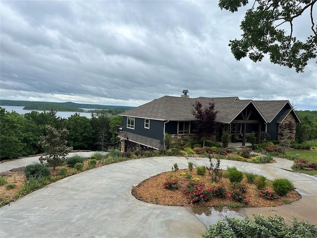 view of front of house featuring a water view