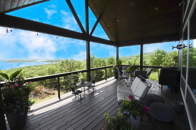 wooden deck featuring a water view