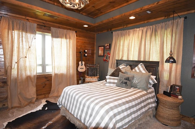 bedroom featuring carpet, wood ceiling, and wood walls