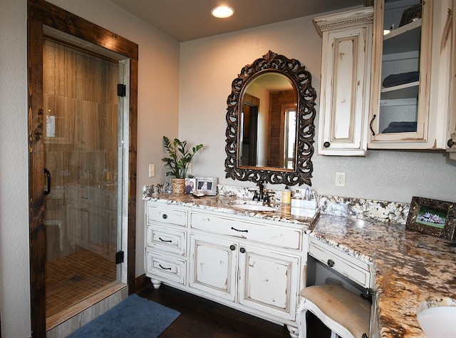 bathroom with vanity and walk in shower