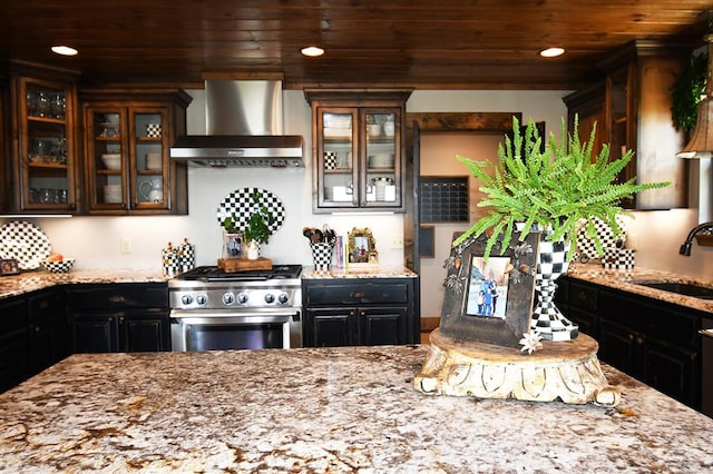 kitchen featuring light stone countertops, sink, wall chimney exhaust hood, wooden ceiling, and high end range