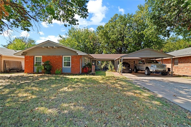 ranch-style home featuring a front yard and a carport