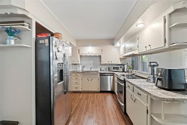 kitchen featuring tasteful backsplash, ornamental molding, stainless steel appliances, sink, and dark hardwood / wood-style floors