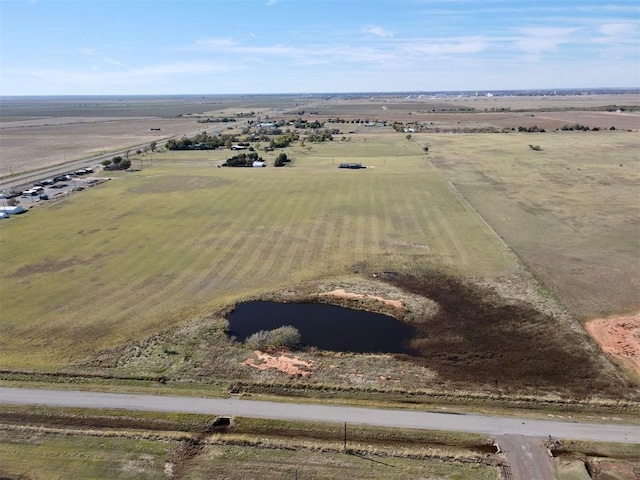 birds eye view of property with a rural view