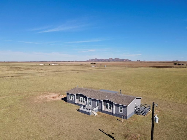 bird's eye view featuring a mountain view and a rural view