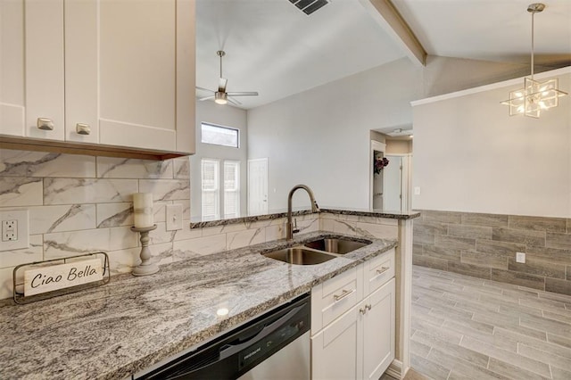 kitchen with white cabinetry, light stone countertops, sink, lofted ceiling with beams, and stainless steel dishwasher