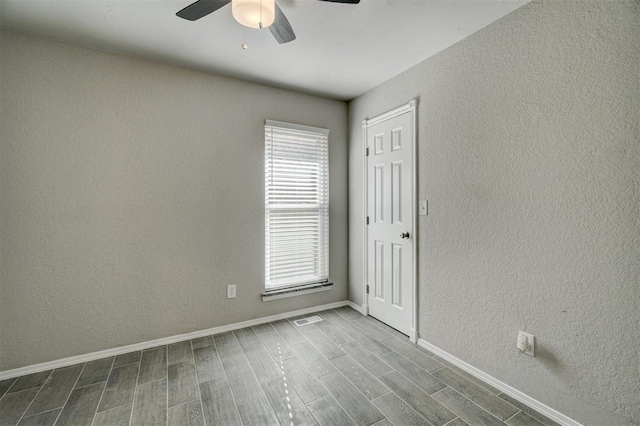 unfurnished room featuring ceiling fan and wood-type flooring