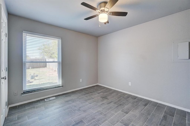 empty room with hardwood / wood-style floors and ceiling fan