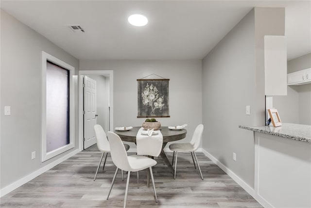 dining room featuring light hardwood / wood-style floors