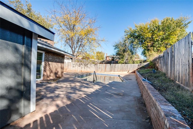 wooden terrace with a patio