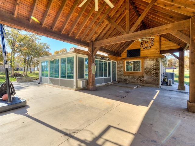 view of patio / terrace featuring a sunroom