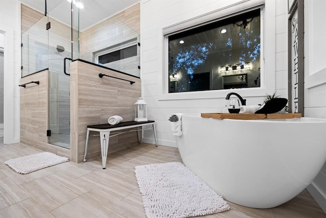 bathroom featuring plus walk in shower