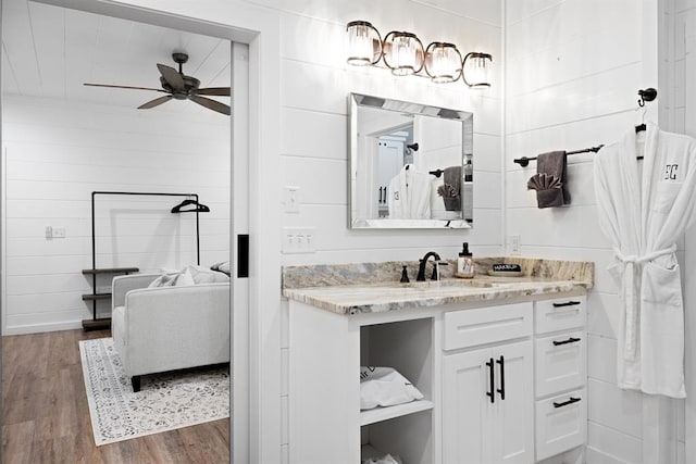 bathroom with vanity, hardwood / wood-style flooring, and ceiling fan