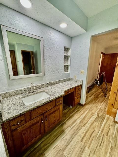 bathroom featuring vanity and wood-type flooring