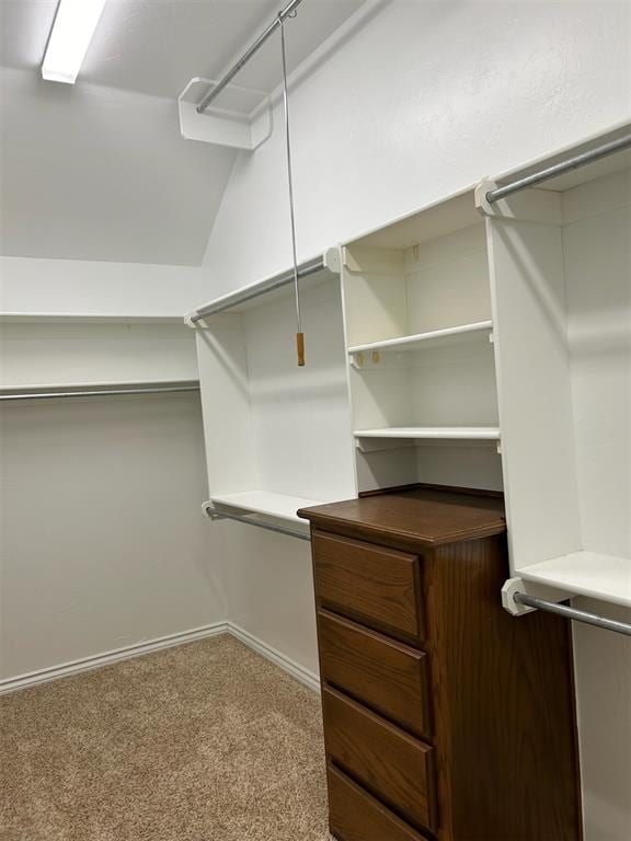 spacious closet with carpet and lofted ceiling