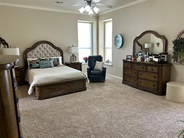 carpeted bedroom featuring ceiling fan and ornamental molding