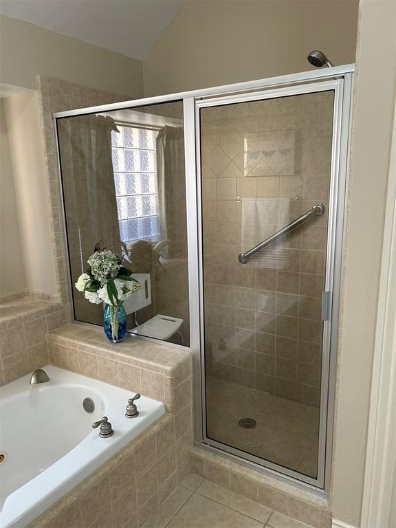 bathroom featuring separate shower and tub and tile patterned floors