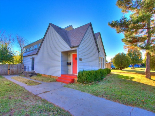 view of front of property with a front lawn