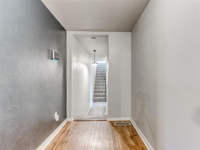 hallway featuring hardwood / wood-style flooring