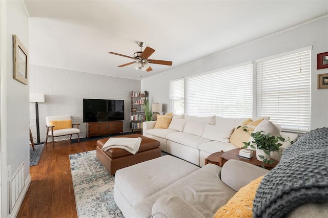 living room with ceiling fan and dark hardwood / wood-style floors