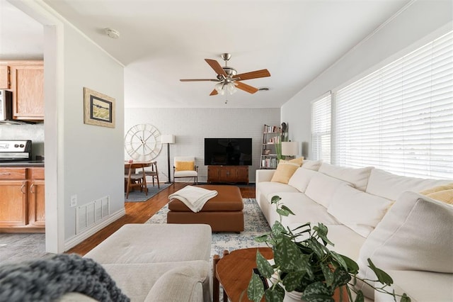 living room with ceiling fan and light hardwood / wood-style floors