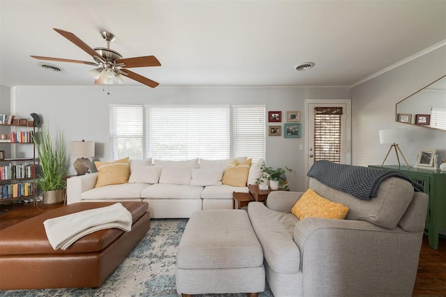 living room featuring ceiling fan and ornamental molding