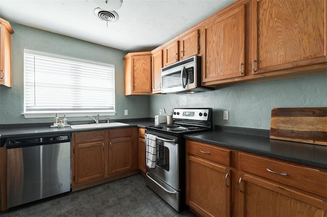 kitchen featuring appliances with stainless steel finishes and sink