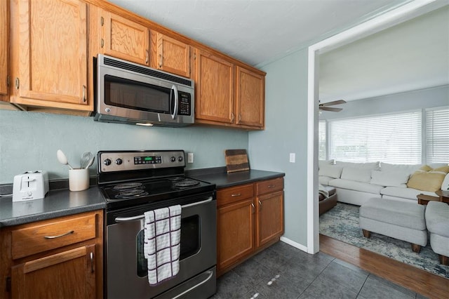 kitchen with ceiling fan and appliances with stainless steel finishes