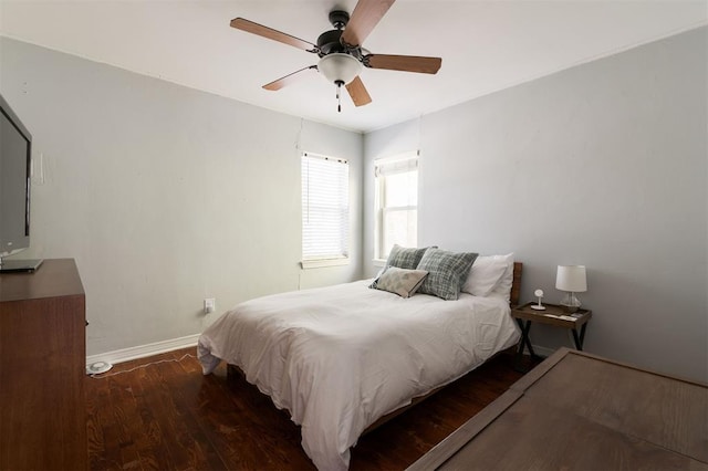 bedroom featuring ceiling fan and dark wood-type flooring