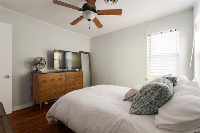 bedroom featuring ceiling fan and dark hardwood / wood-style flooring