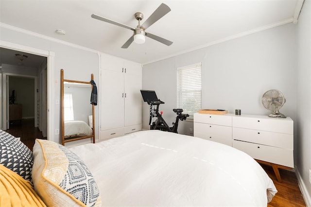 bedroom with hardwood / wood-style floors, ceiling fan, and ornamental molding