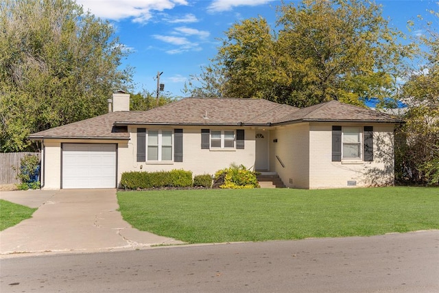 ranch-style house featuring a front yard and a garage