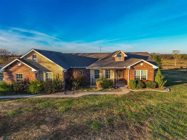 ranch-style home featuring a front yard