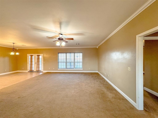 spare room with carpet, ceiling fan with notable chandelier, and ornamental molding